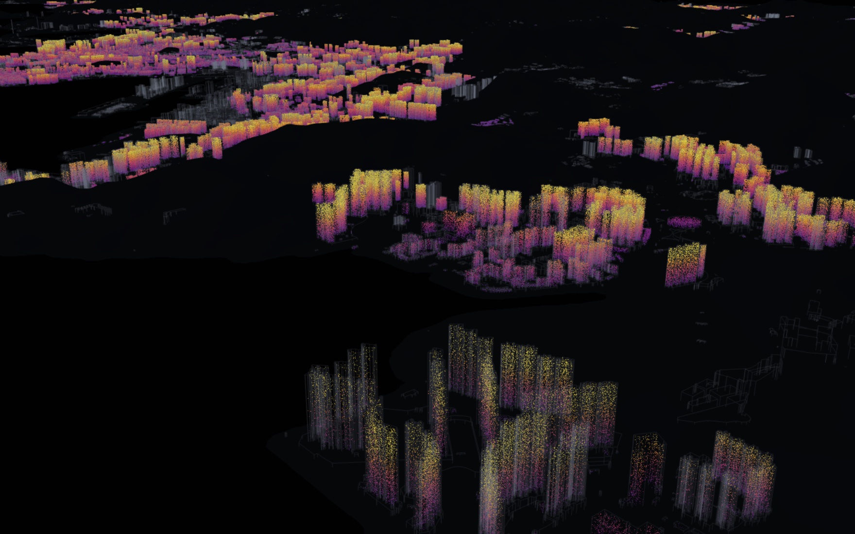 Tseung Kwan O's towers at night, residents glowing from purple on low floors to yellow at the top